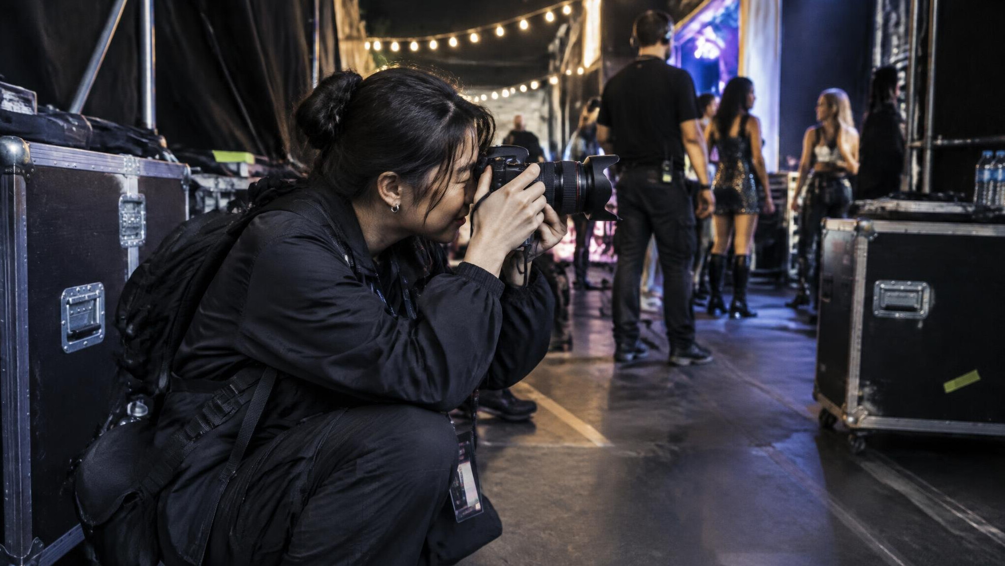 Photographer capturing behind the scenes coverage at an entertainment event
